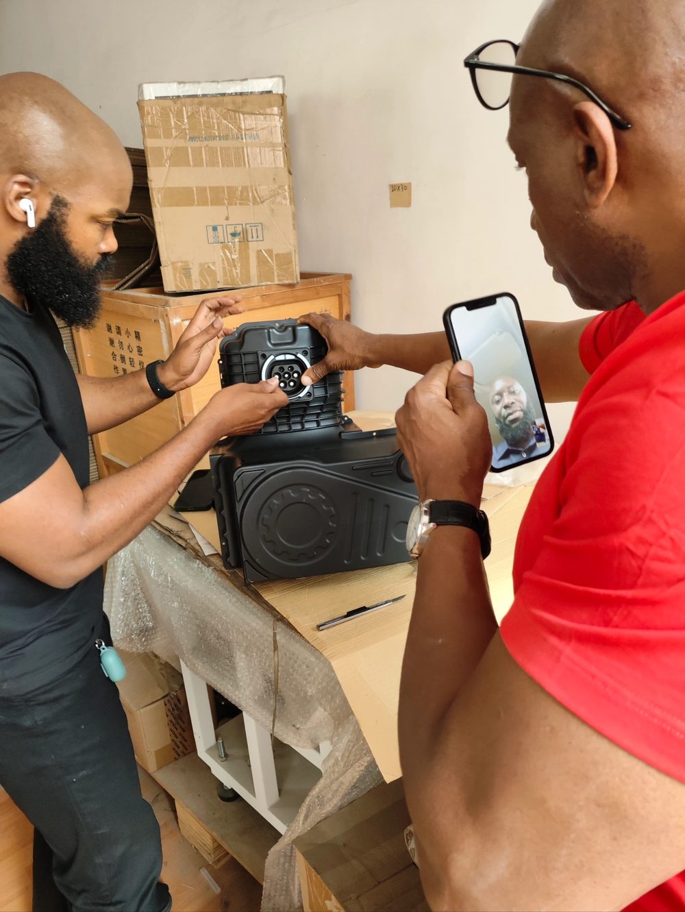 Customer engineer operating a device while a teammate records the session