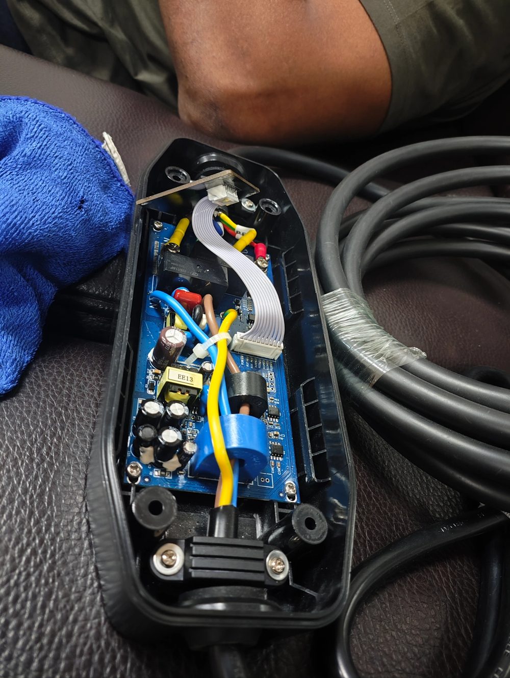 The customer's charging gun opened up for checking against the battery case port